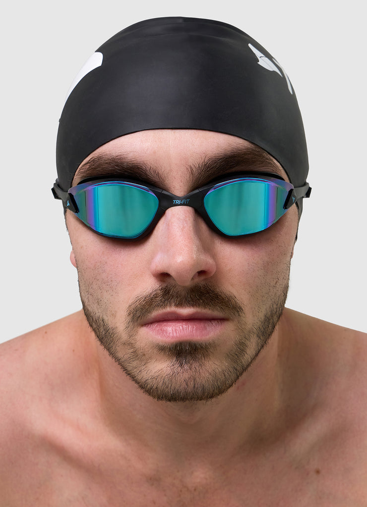 Man wearing TRI-FIT PROPEL Swim Goggles in black with blue/purple mirrored lens. Part of the award-winning TRI-FIT Goggle range.