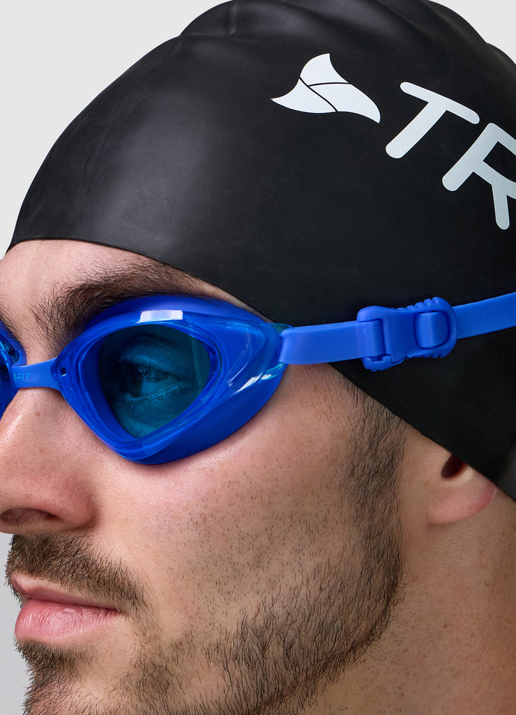 Male wearing TRI-FIT VOLT BLUE swimming goggles.