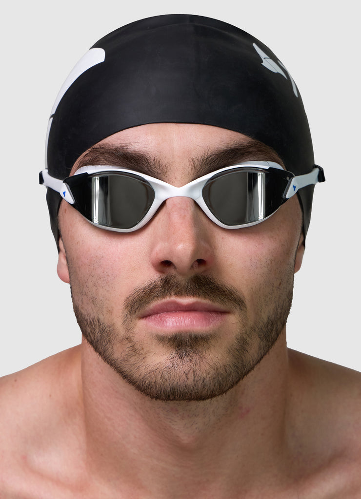 Male wearing TRI-FIT PROPEL in white swimming goggles.