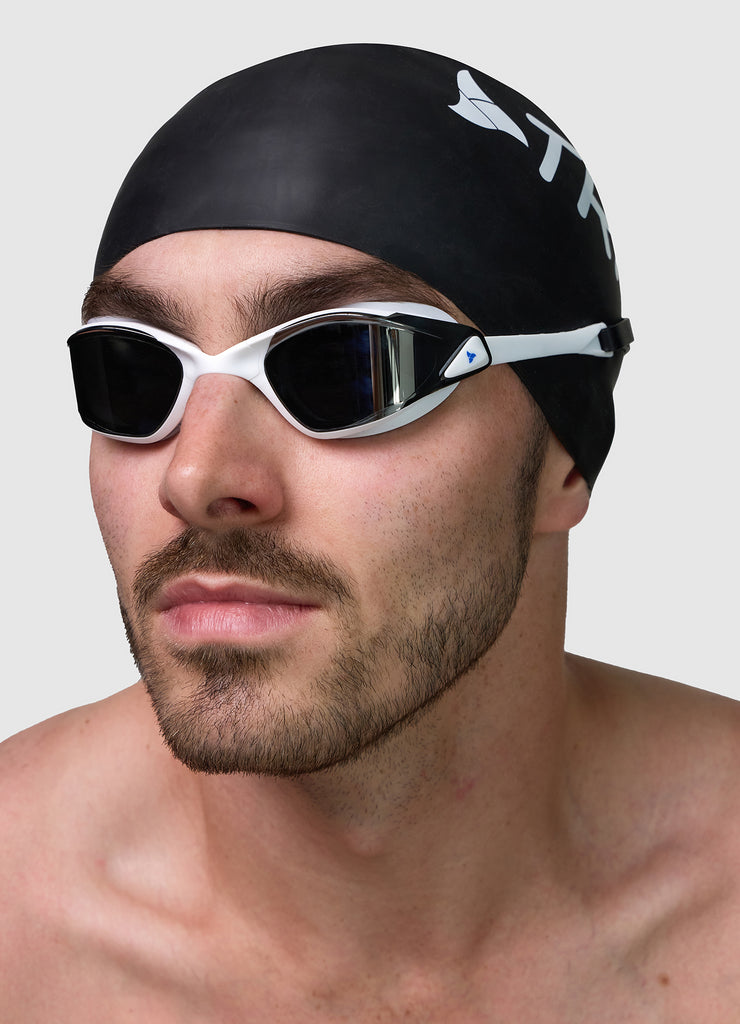 Male wearing TRI-FIT PROPEL in white swimming goggles.