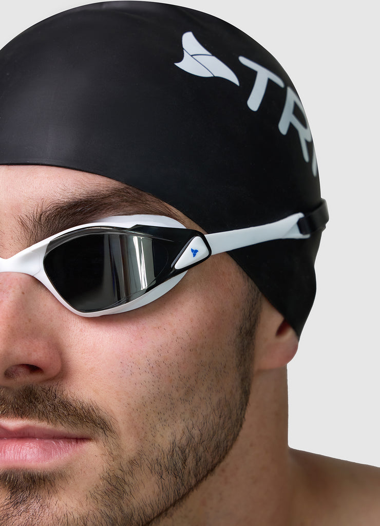Male wearing TRI-FIT PROPEL in white swimming goggles.