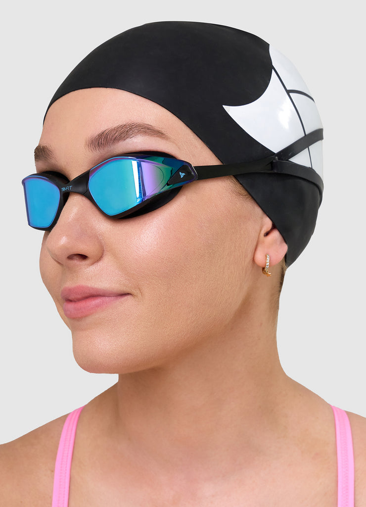 Man wearing TRI-FIT PROPEL Swim Goggles in black with blue/purple mirrored lens. Part of the award-winning TRI-FIT Goggle range.