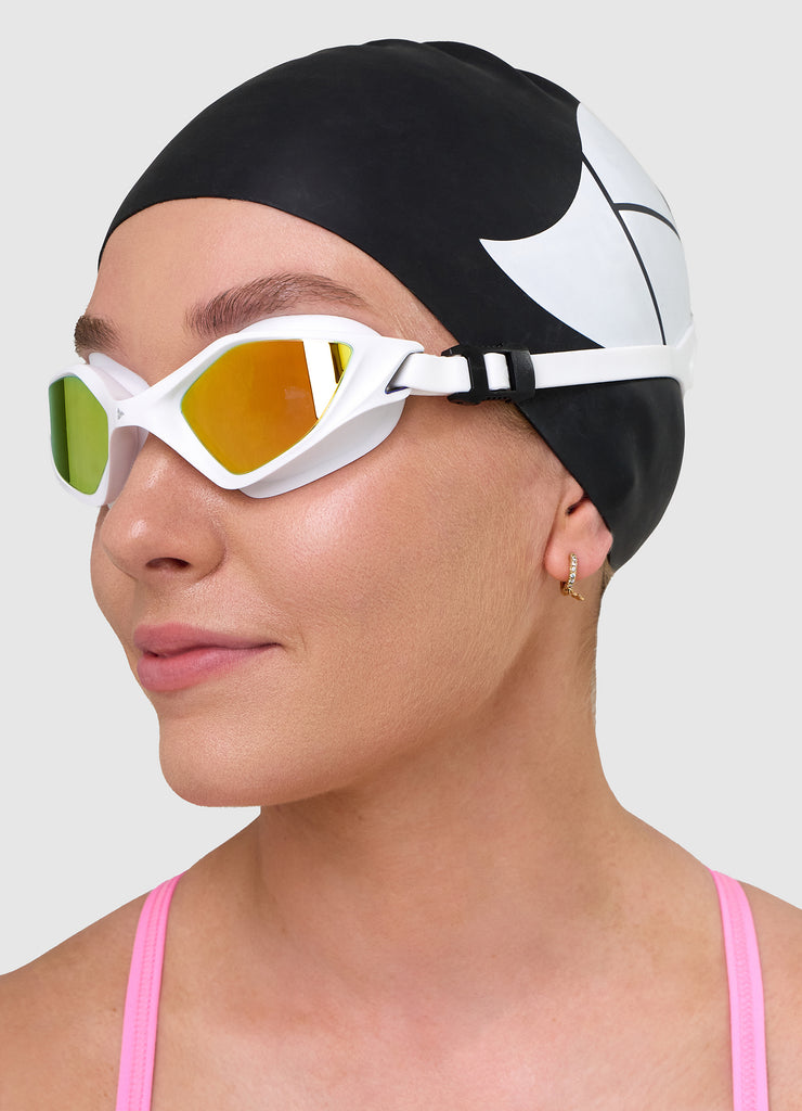 Female swimmer wearing TRI-FIT RAPID-X swim goggles in white