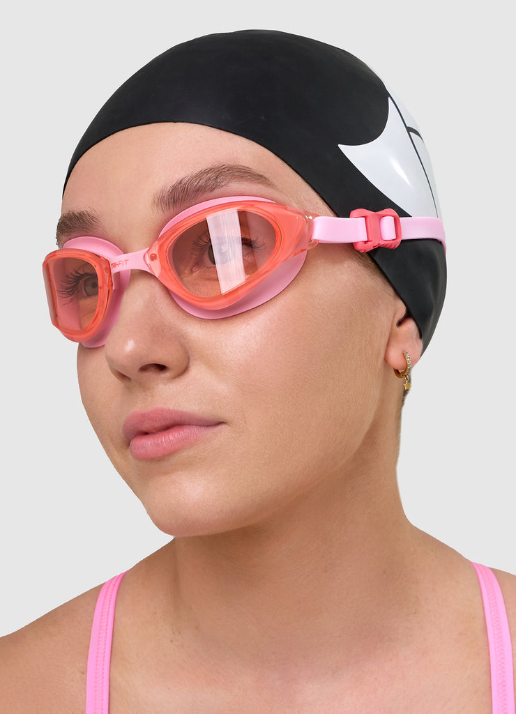 Female wearing TRI-FIT VOLT PINK swimming goggles.