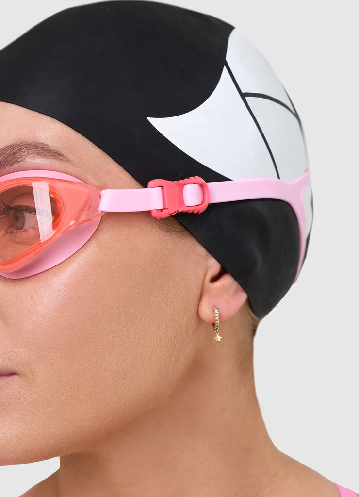 Female wearing TRI-FIT VOLT PINK swimming goggles.