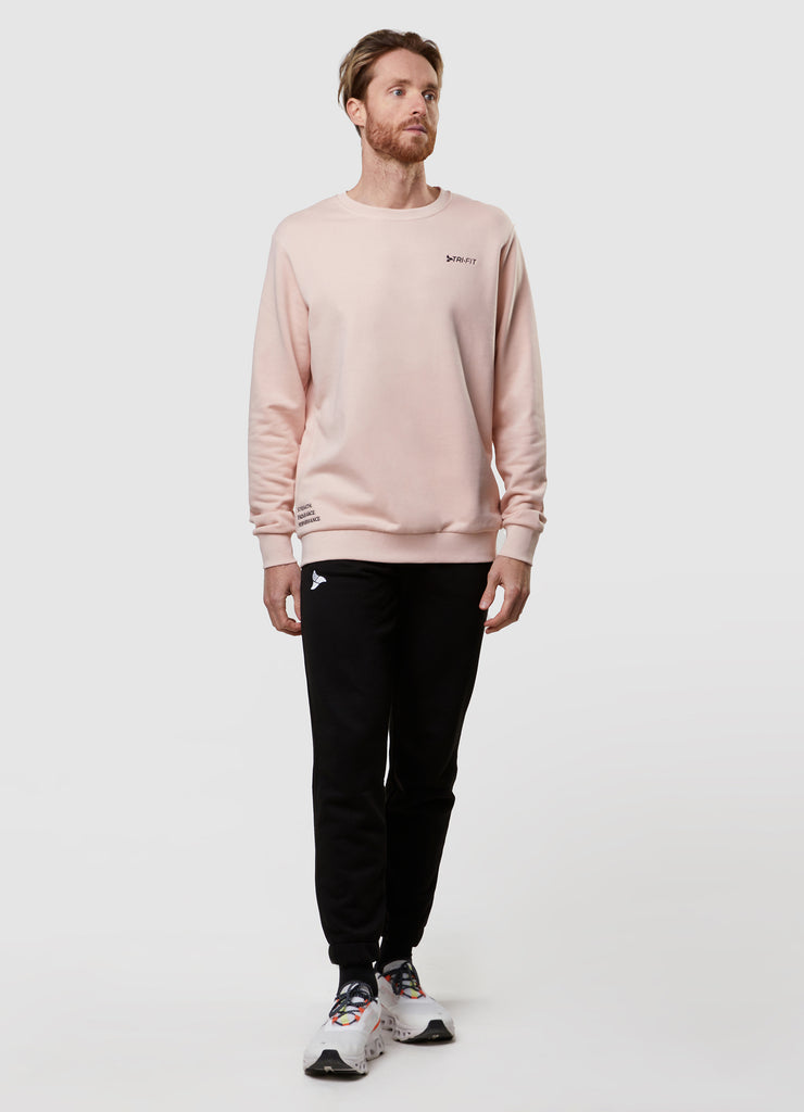 Man wearing TRI-FIT dusty pink crew neck sweater