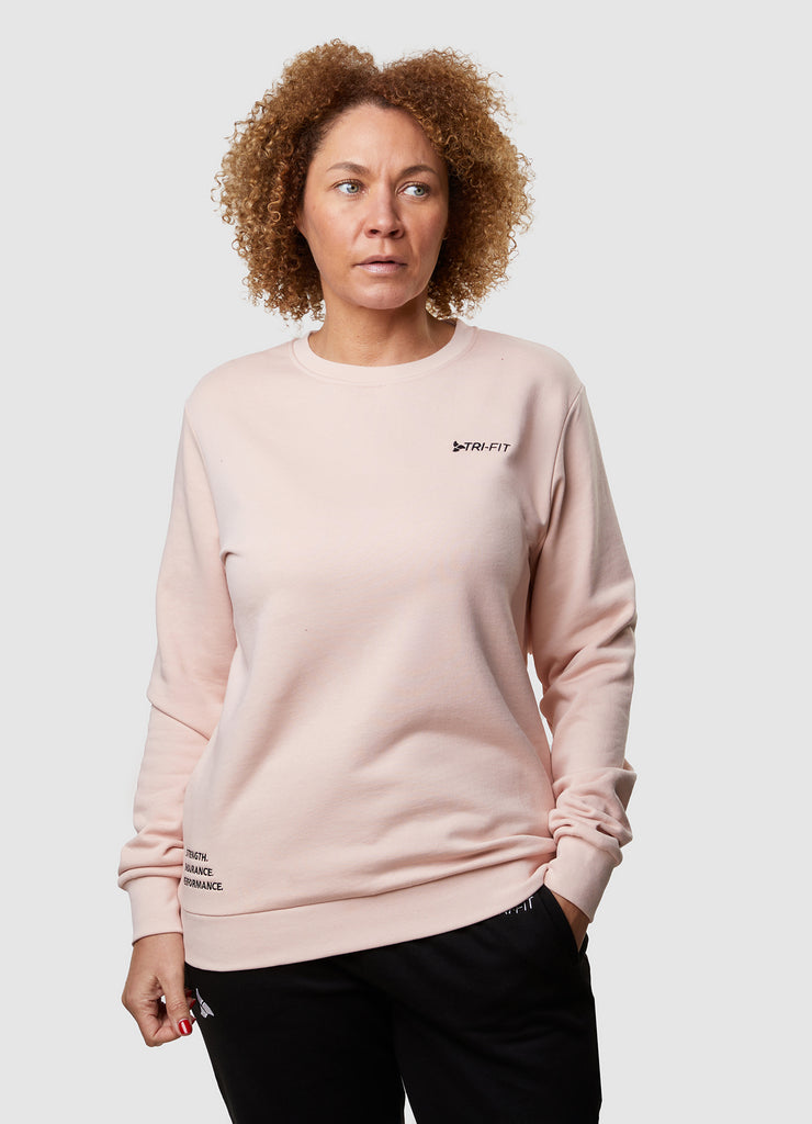 Woman wearing TRI-FIT Casualwear dusty pink sweatshirt