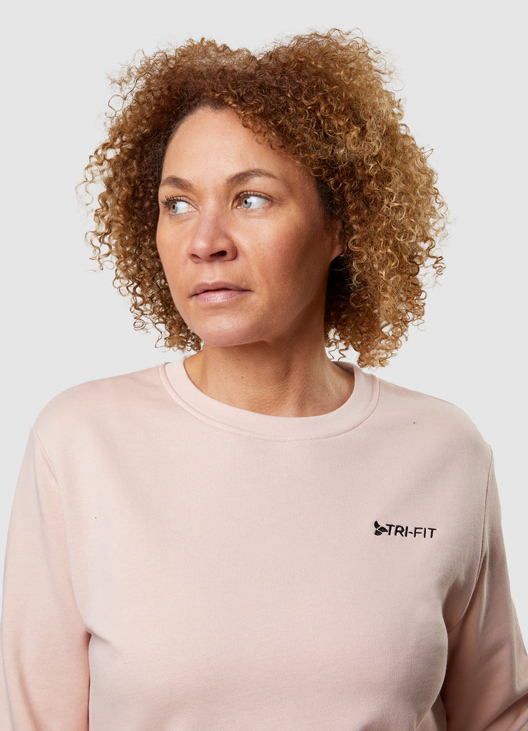 Woman wearing TRI-FIT Casualwear dusty pink sweatshirt