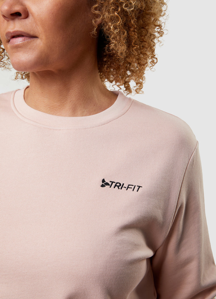 Woman wearing TRI-FIT Casualwear dusty pink sweatshirt