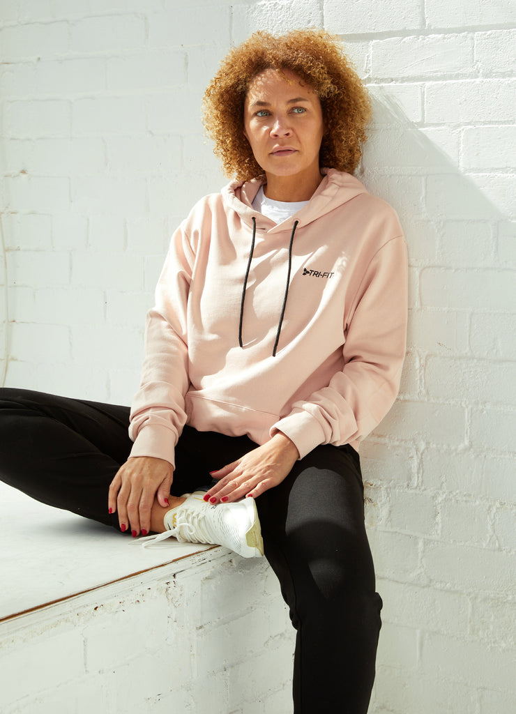 Woman wearing TRI-FIT Casualwear dusty pink hoodie