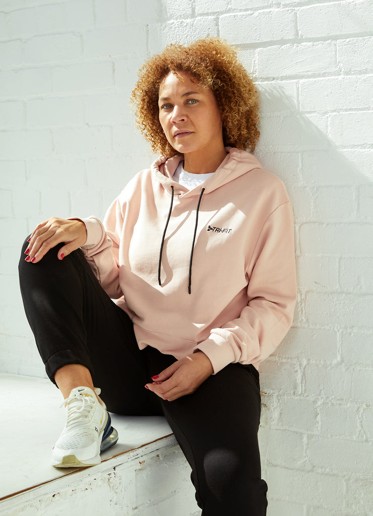 Woman wearing TRI-FIT Casualwear dusty pink hoodie